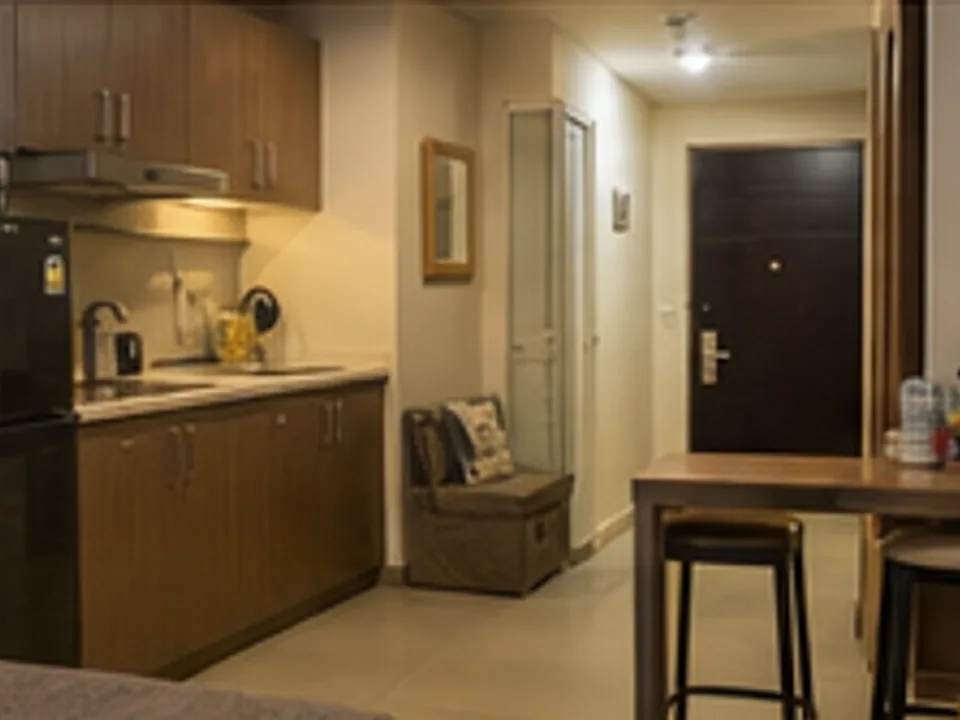 furnished apartment, kitchen, living area, and arrival support